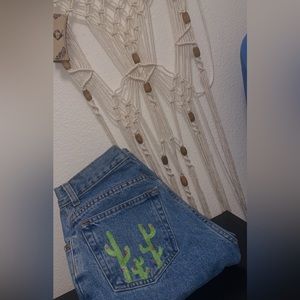 Vintage old navy jeans with cactus painting